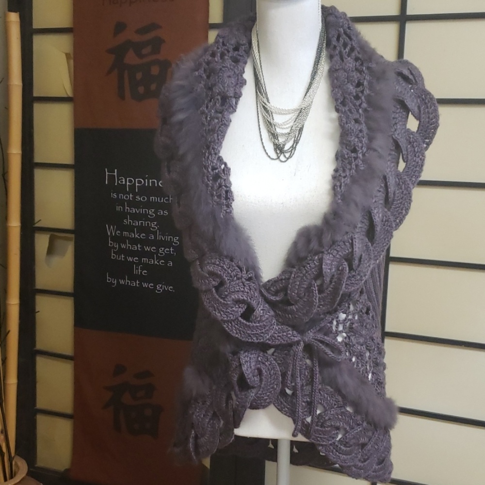 Purple crocheted sweater vest.